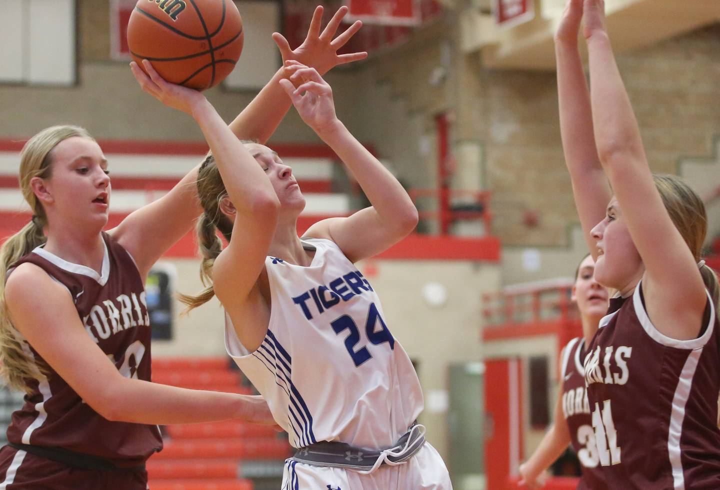 Princeton's Keighley Davis eyes the hoop while being guarded in the lane by Morris's Landrie Callahan and Alyssa Jepson during the Lady Pirate Holiday Tournament on Wednesday, Dec. 20, 2023 in Kingman Gym.