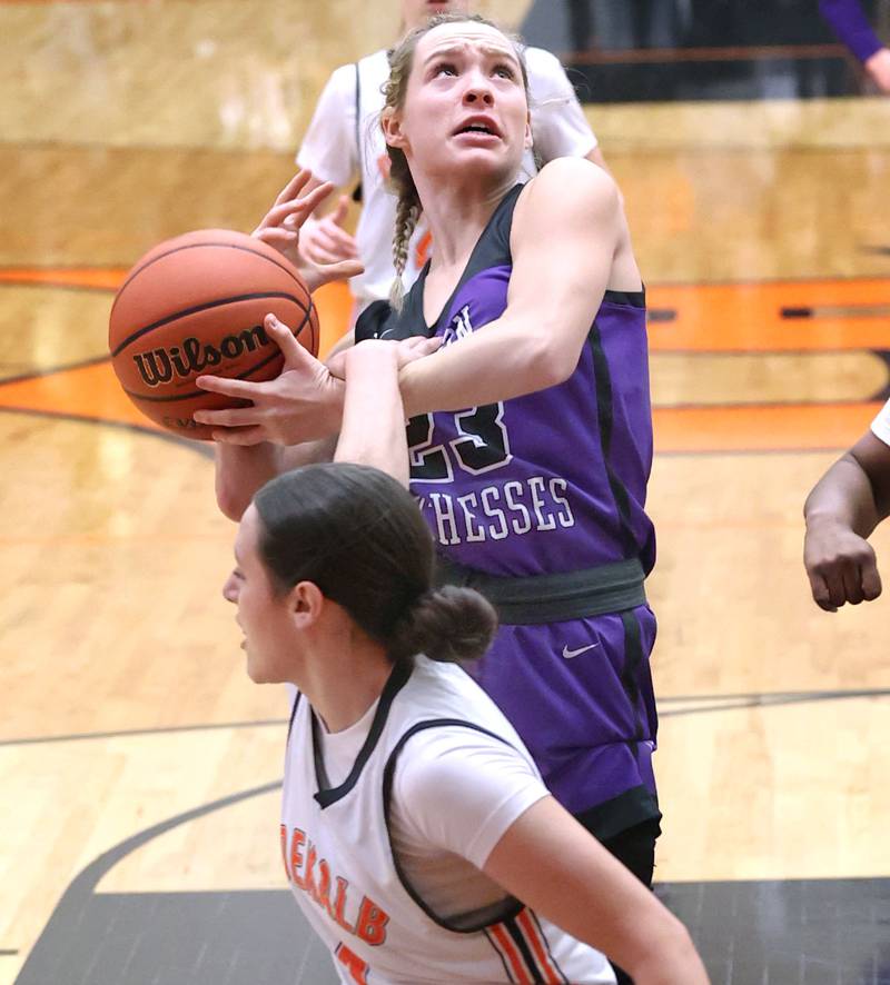 Dixon’s Hannah Steinmeyer is fouled by DeKalb’s Ella Medina during their game Monday, Jan. 23, 2023, at DeKalb High School.