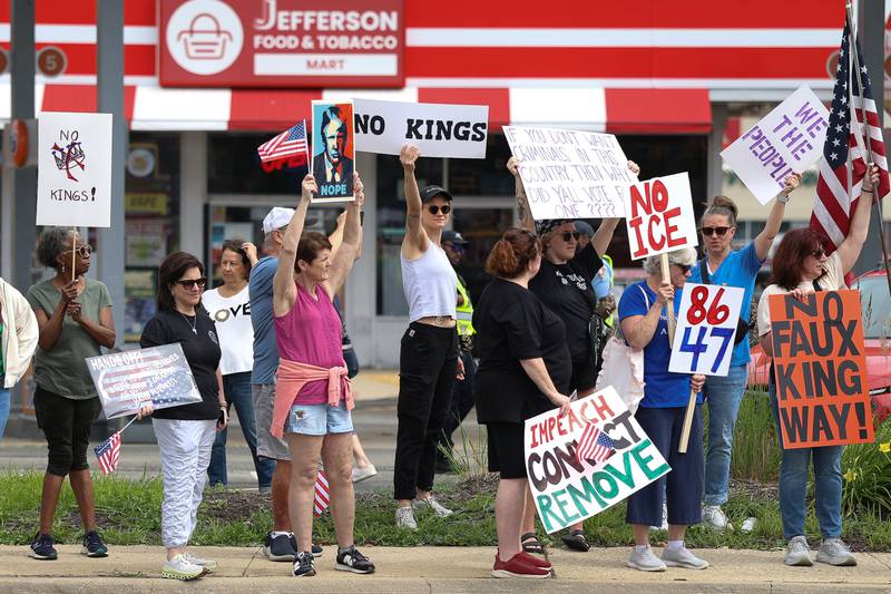 Protesters line West Jefferson Street near the intersection of Larkin Avenue for the No Kings Day protest on Saturday,  June 14, 2025 in Joliet.