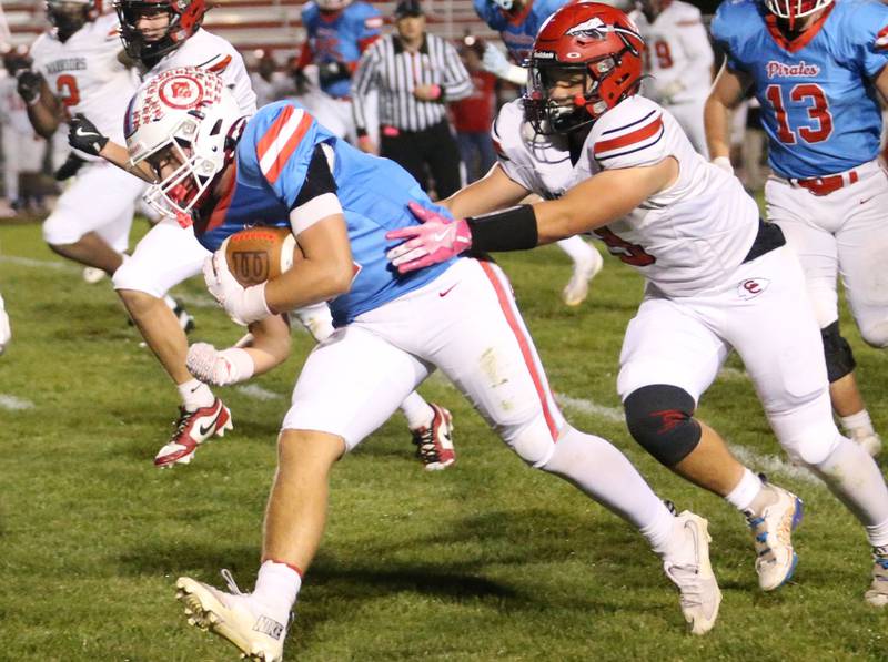 Ottawa's Archer Cechowiz breaks free of Granite City's Eli Miller on a run in the first quarter on Friday, Oct. 24, 2025 on Kingman Field at Ottawa High School.