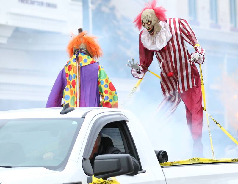 Animatronic Halloween characters ride in the back of a pickup truck during the 5th annual Halloween Parade on Saturday, Oct. 28, 2023 downtown Princeton.