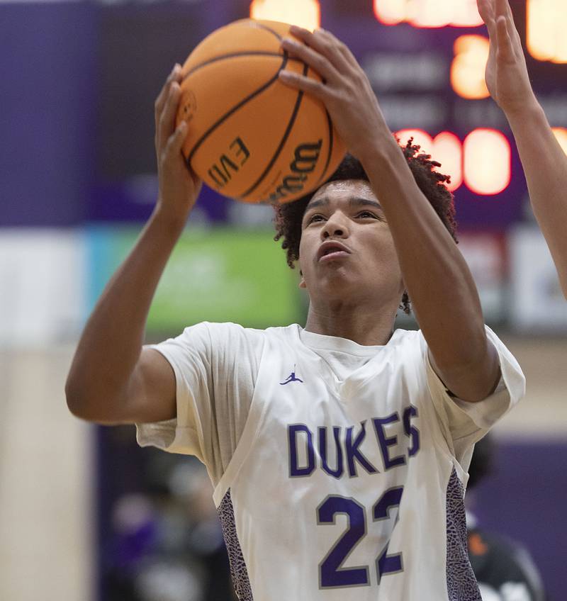 Dixon’s Xavion Jones goes up for a shot against Kewanee Tuesday, Dec. 2, 2025.
