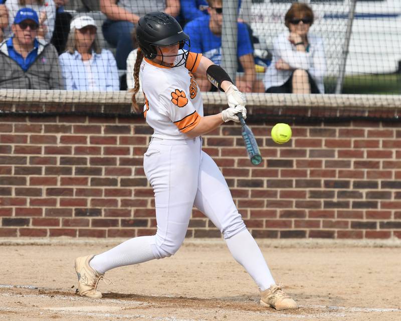 Wheaton Warrenville South's Avery Arnold (17) makes contact with the ball but was thrown out at first during the sectional semifinal game while taking on Weaton Warrenville South on Thursday June 5, 2025, held at Oswego High School.
