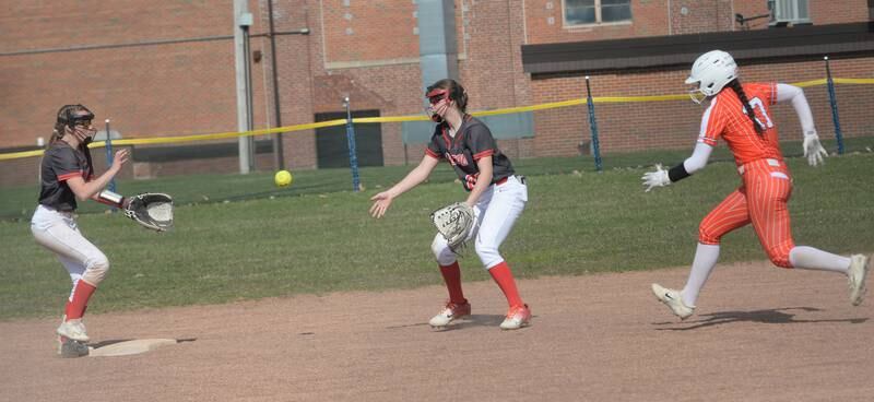 Fulton second baseman Wrenn Coffey tosses the ball to Kira Wilson who steps on second base for the force out against Milledgeville at the Pearl City Tournament on Saturday, April 12, 2025.