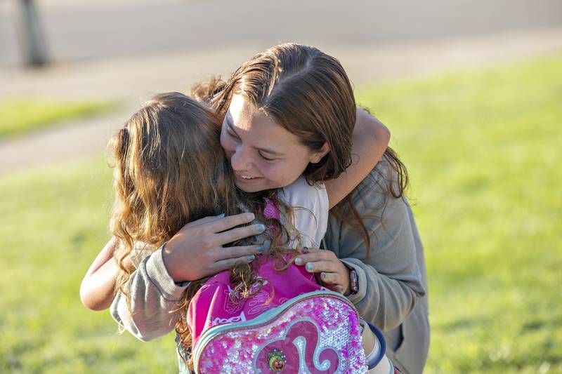 Alyssa Arocho gives Milani Webb, 5, a hug before the young lady goes to school Wednesday, Aug. 13, 2025, at Washington in Dixon.