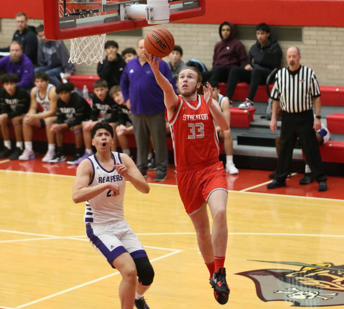 Streator's Quin Baker runs to the hoop to score over Plano's Isiah Martinez during the Dean Riley Shootin' The Rock Thanksgiving Tournament on Monday, Nov. 20, 2023 at Kingman Gym.