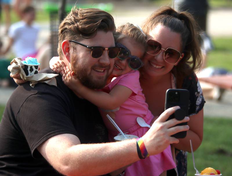 Patrick Treanor of Crystal Lake and his wife, Karolina, take a selfie with daughter Sophia, 2, Friday, Aug. 18, 2023, during Julie Ann’s first-ever Ice Cream Fest at Crystal Lake’s Main Beach.