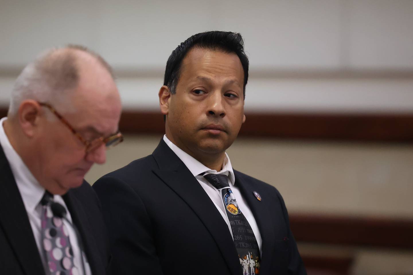 Javier Esqueda sits with his attorney Jeff Tomczak during a status hearing at Kendall County Courthouse. Esqueda faces official misconduct charges for leaking video of Eric Lurry’s arrest. Lurry died from a drug overdose. Tuesday, June 14, 2022 in Yorkville.