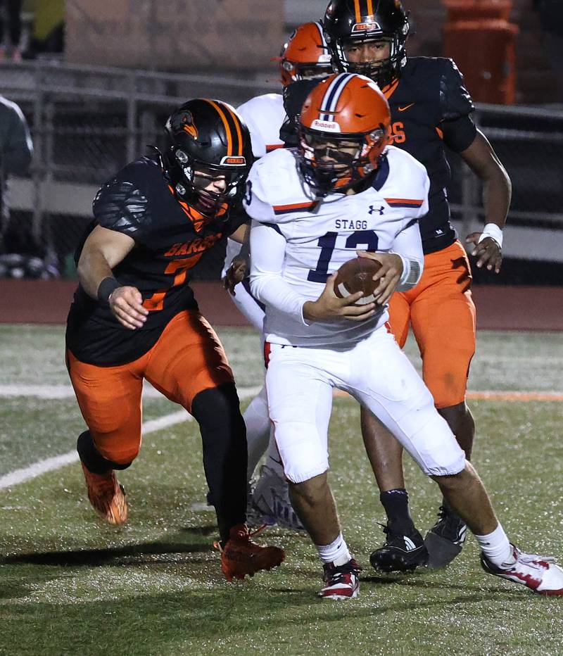 DeKalb's Matthew Clayton (left) and Justin O’Neal sack the Stagg quarterback during their game Friday, Oct. 25, 2024, at DeKalb High School.