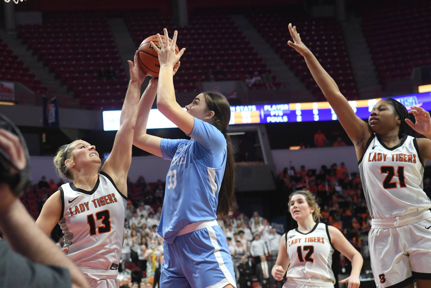 Breese Mater Dei's Alyssa Koerkenmeier (33) shoots as Byron's Ella Grundstrom (13) tries to get a piece of the ball during the 2A championship at Redbird Arena in Normal on Saturday, March 4.
