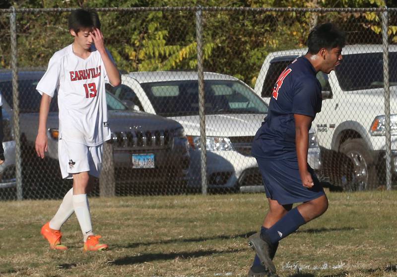 DePue/Hall's Osvaldo Morales (right) reacts after scoring a goal as Earlville's CJ Fuller shows his frustration during the Class 1A Regional quarterfinal game on Wednesday, Oct. 16, 2024 in DePue.