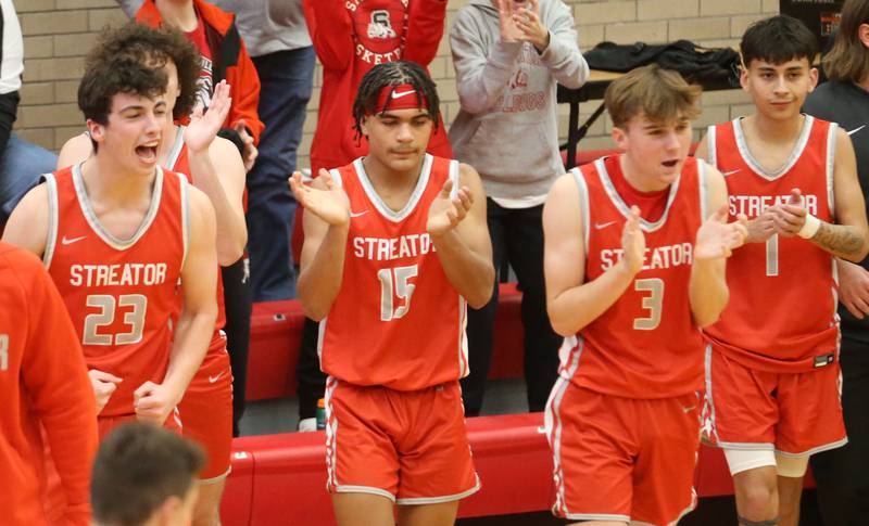 Streator players react after defeating L-P during the Dean Riley Shootin' The Rock Thanksgiving Tournament on Monday, Nov. 25, 2024 in Kingman Gym at Ottawa High School.
