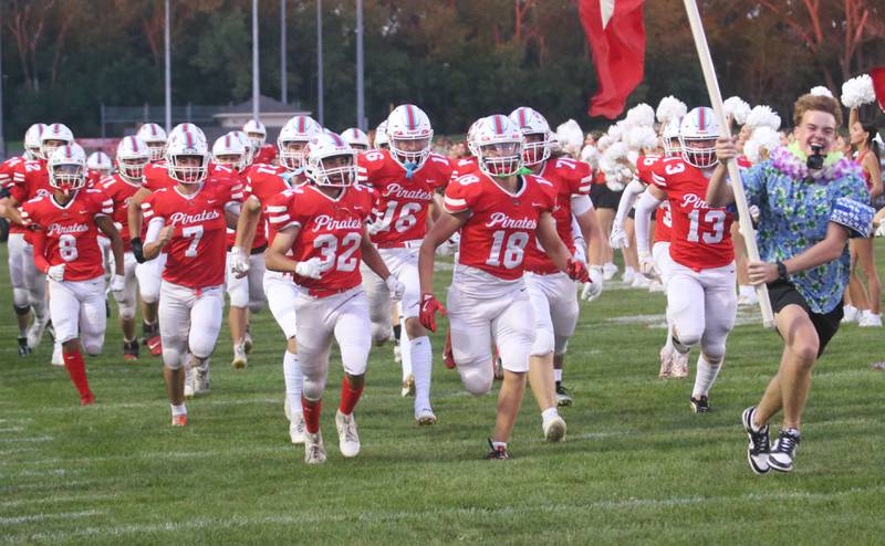 Members of the Ottawa football team run onto the field before playing Plano on Friday, Aug. 30, 2024 at King Field.