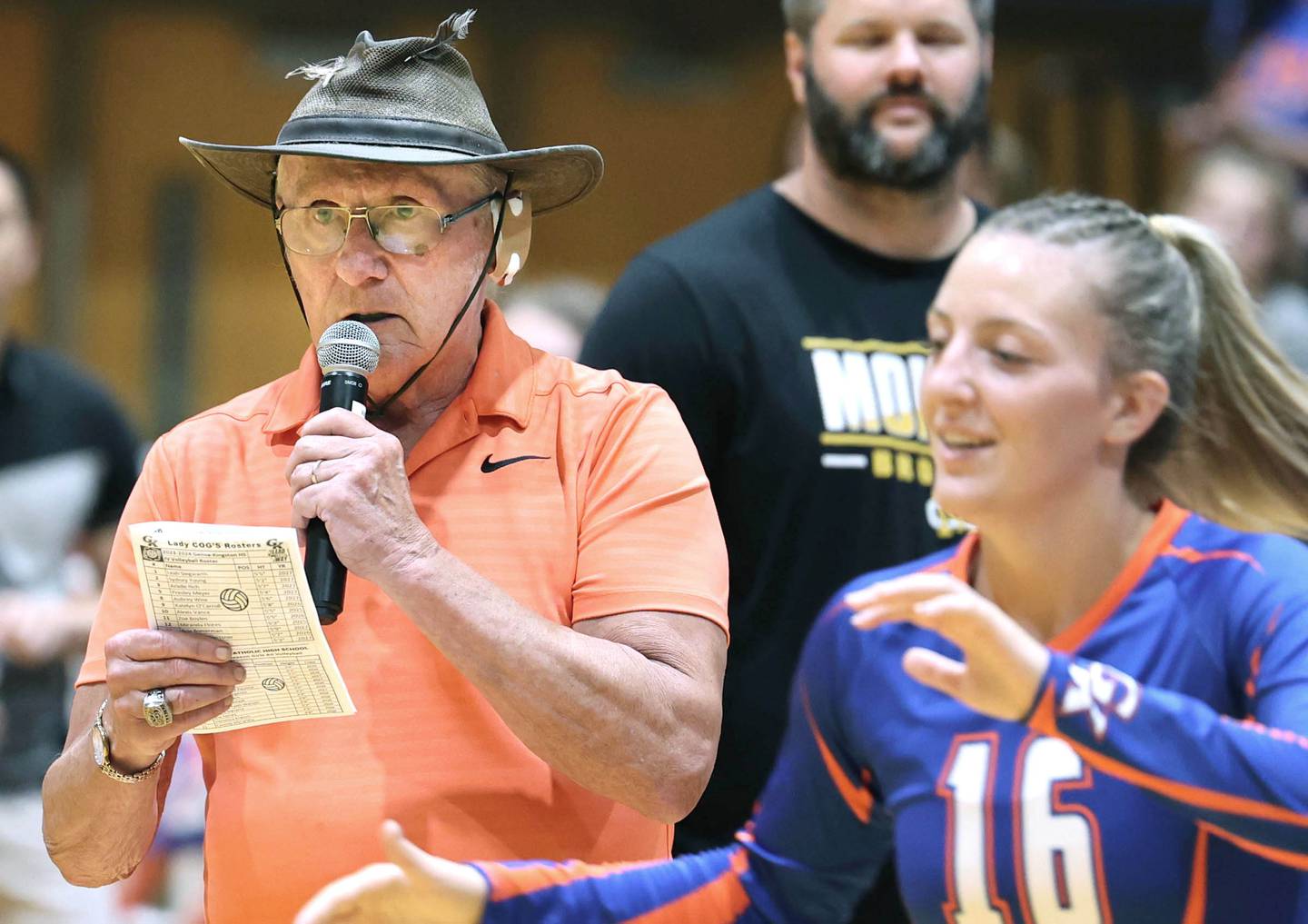 U.S. Navy veteran Jim Kush announces the starters for the Genoa-Kingston volleyball team Tuesday, Sept. 5, 2023, before working as the official score keeper during the game. Kush also has sung the national anthem at Genoa-Kingston sporting events.