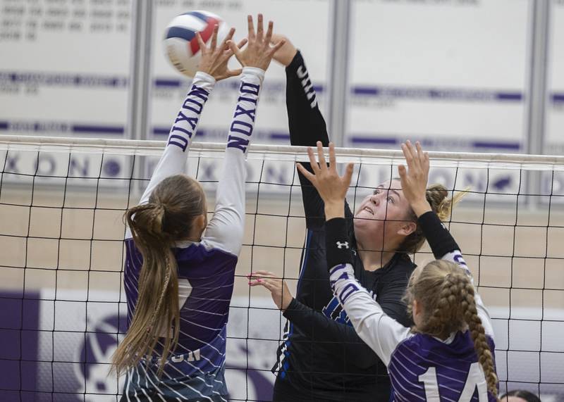 Newman’s Kennedy Rowzee works the net Monday, August 28, 2023 during a non-conference match-up in Dixon.