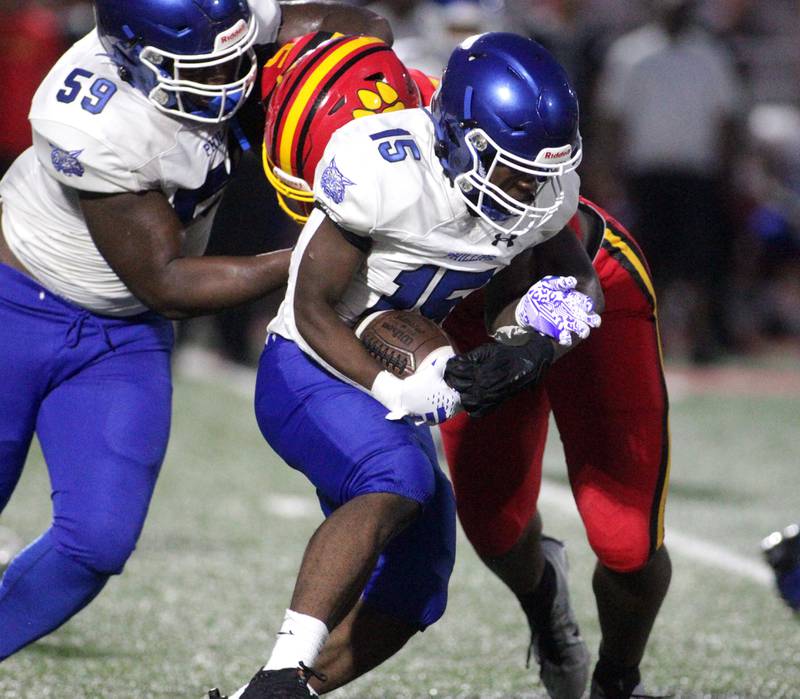 Phillips’ Emilio Louis-Jean runs the ball during the season-opener in Batavia on Friday, Aug. 25, 2023.