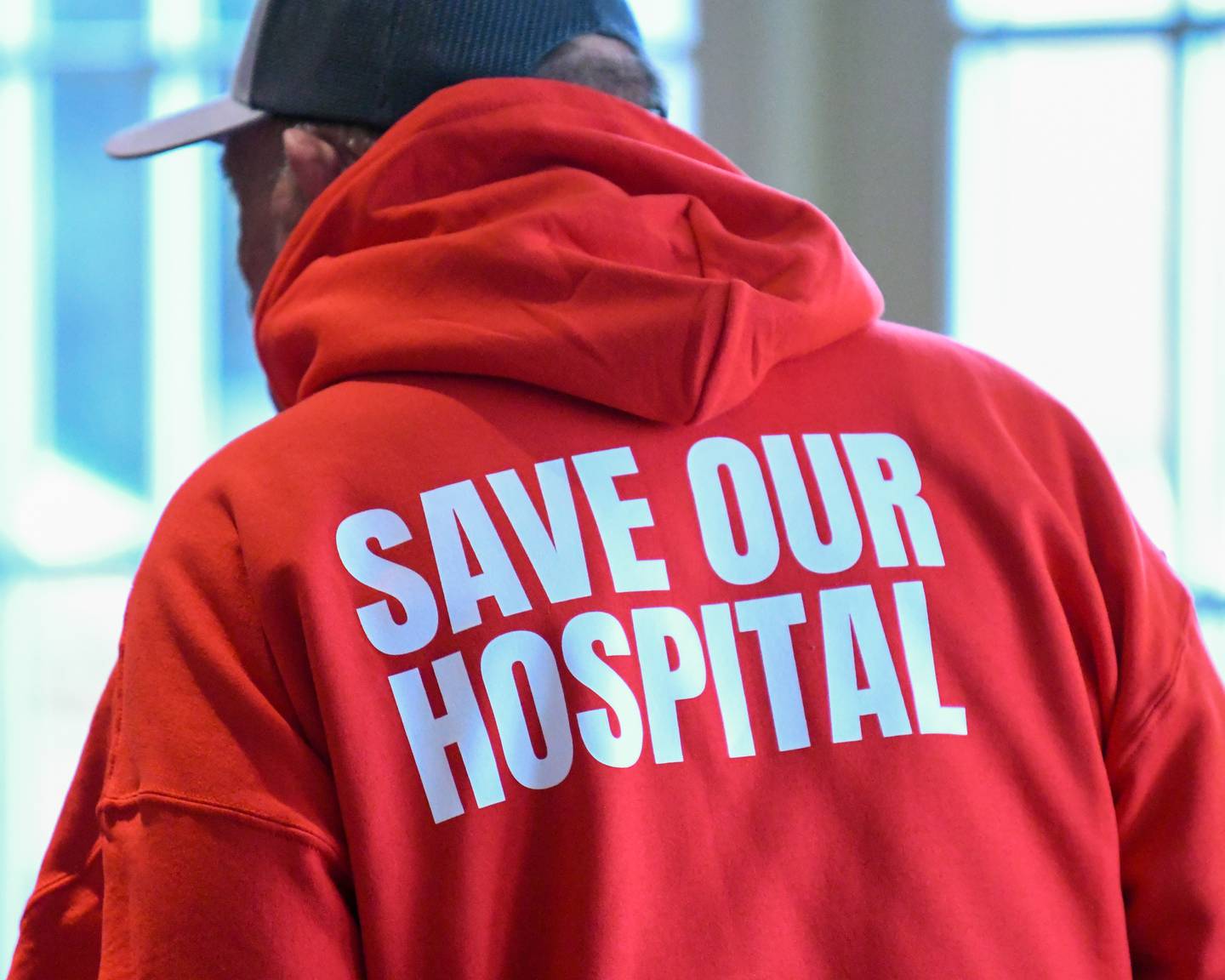 Ottawa community members show their support by wearing the phrase “Save Our Hospital” or by wering red  attire during the Illinois board meeting on Tuesday Nov. 18, 2025, held at the Bolingbrook Golf Course in Bolingbrook.