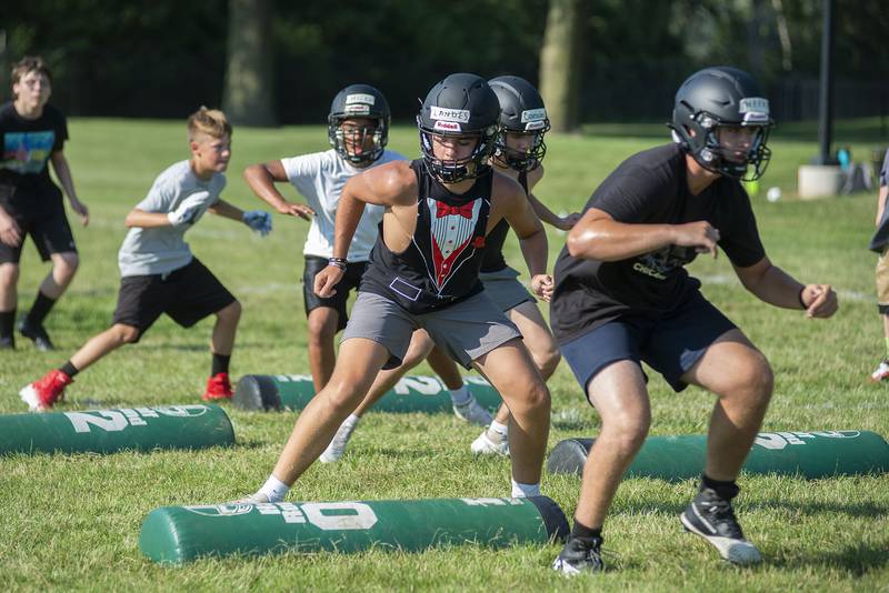 Mason Landes (middle) drills at Rock Falls High School Tuesday, July 19, 2022.