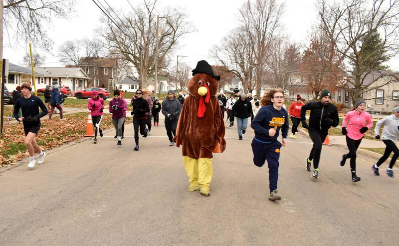 In 30 degree temperatures Turkey Trotter, a.k.a. Elaine Hand, led the pack as 80 runners and walkers competed in Morrison's first 5k race on Saturday, Nov. 25 at Morrison High School.
