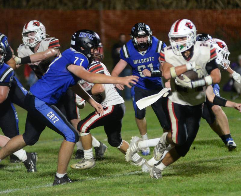 Eastland-Pearl City's Tristan Ertmer (77) gets ready to tackle Forreston's Mickey Probst (24) during a game at Pearl City High School on Friday, Oct. 3, 2025.