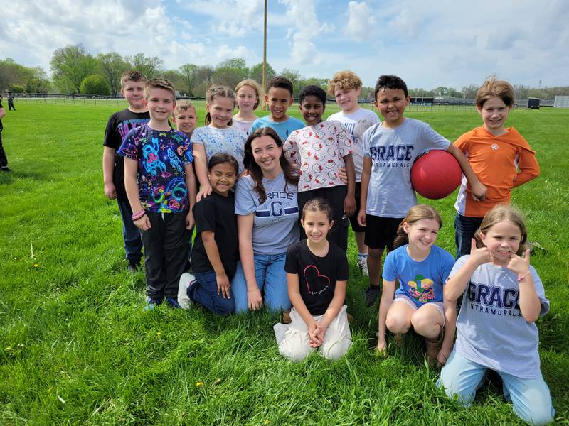 Grace Christian Academy teacher Christine Johnson gathers outside with her third grade students. Johnson took the lead with helping to organize the school's donation drop-off zone after the March 10, 2026 tornado.