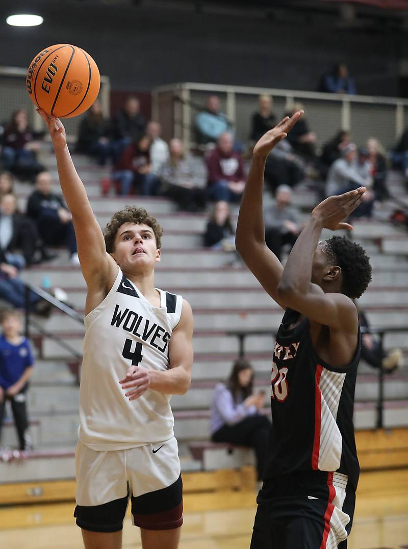 Prairie Ridge's Lucas Michalios drives to the basket against Huntley's Isaiah Onu during a Fox Valley Conference boys basketball game on Wednesday, Jan. 21, 2026, at Prairie Ridge High School in Crystal Lake.