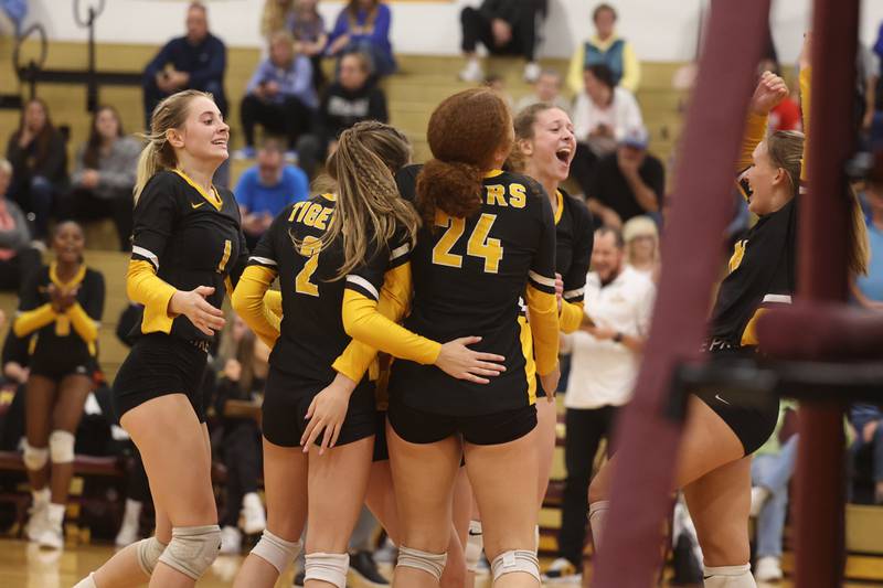 Joliet West celebrate a 1st set win against Sandburg in the in the Class 4A Lockport Sectional title match on Wednesday.