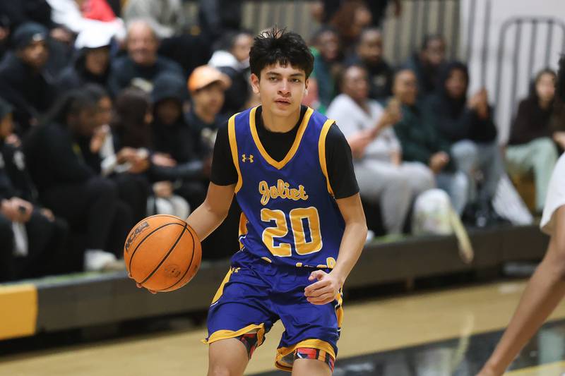 Joliet Central’s Valentin Conejo looks for a play against Joliet West on Tuesday, Feb. 17, 2026 in Joliet.