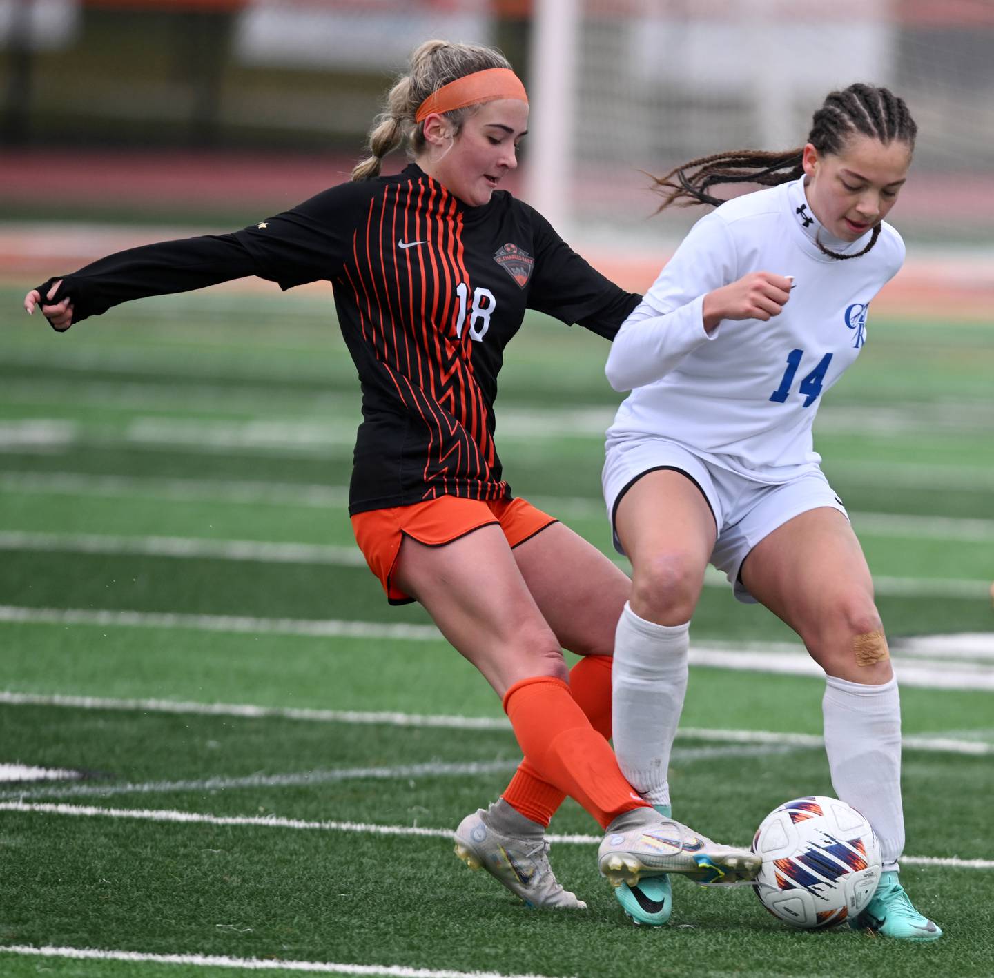 St. Charles East’s Payton Rivard, left, and Burlington Central’s Sydney Batts pursue the ball during a girls soccer match played on  Tuesday, March 26, 2024 in St. Charles.