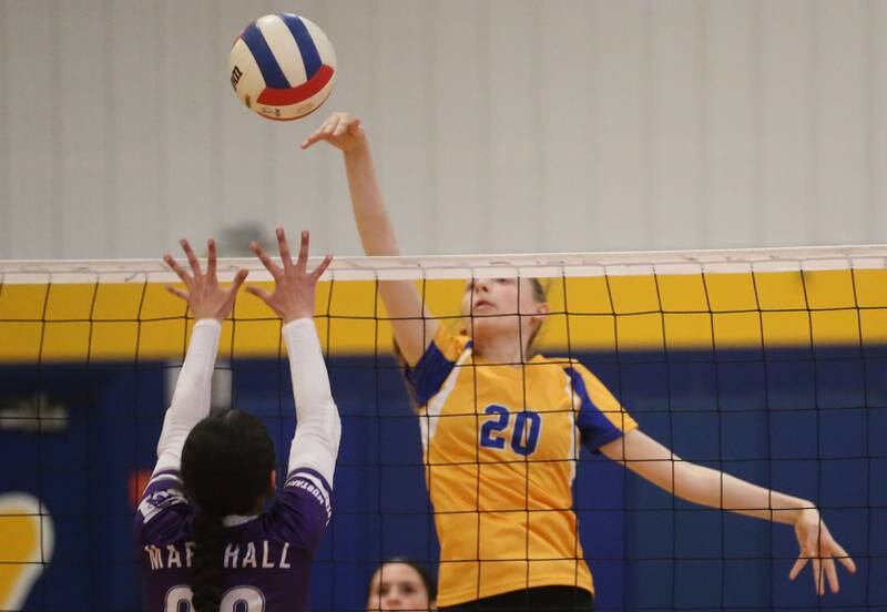 Logan's Kassie Rankin sends a spike past Rockford-Marshall's Zareena Neely during the IESA Class 3A eighth-grade Regional final game on Thursday, March 13, 2025 at Logan Junior High School in Princeton.