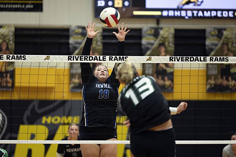 Newman’s Kennedy Rowzee goes up for a block on Rock Falls’ Claire Bickett Thursday, Oct. 26, 2023 in the class 2A regional finals at Riverdale.