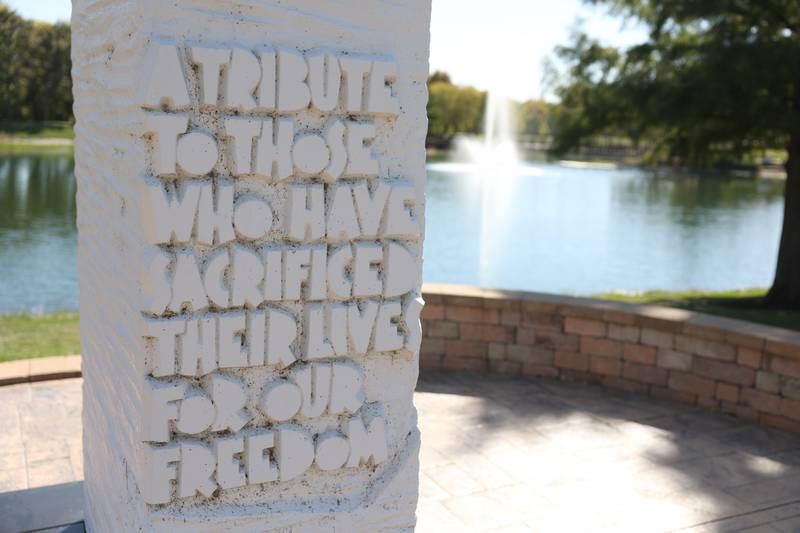 A veterans memorial stands near the lake behind the Plainfield Village Hall on Thursday, Oct. 10, 2024.