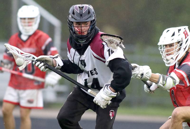 Prairie Ridge’s Justin Morton moves the ball against Huntley in varsity boys lacrosse at Prairie Ridge  High School in Crystal Lake on Thursday, May 1, 2025.