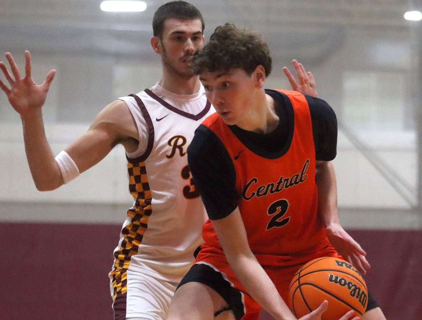 Richmond-Burton’s Jace Nelson, back, guards Crystal Lake Central’s Danny Spychala in varsity boys basketball E.C. Nichols tournament championship game action on Saturday, Dec. 27, 2025, at Homer “Bill” Barry Gymnasium on the campus of Marengo High School in Marengo.