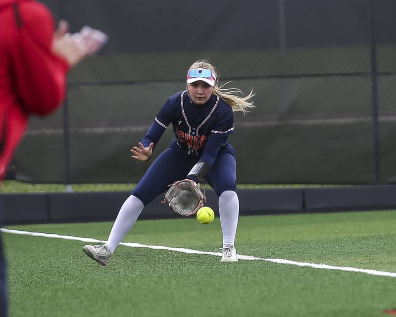 Oswego's Brynn Broughton (1) fields a ground ball in left field during softball game between Oswego at Yorkville. May 5, 2026 in Yorkville.