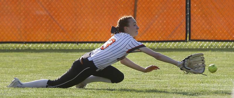 McHenry's Gianna Buske tries to make a diving catch during a Fox Valley Conference softball game Monday, May 9, 2022, between McHenry and Crystal Lake South at McHenry High School.