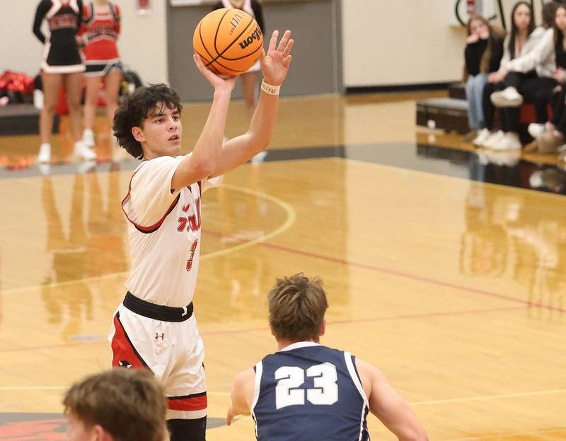 Hall's Noah Plym shoots a jump shot over Fieldcrest's Eli Gerdes during the Colmone Classic on Friday, Dec. 12, 2025 at Hall High School.