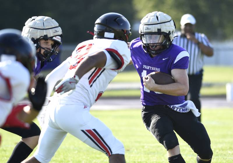 Manteno's Connor Harrod carries the ball on a play in a scrimmage game against Momence on Friday, August 22, 2025.