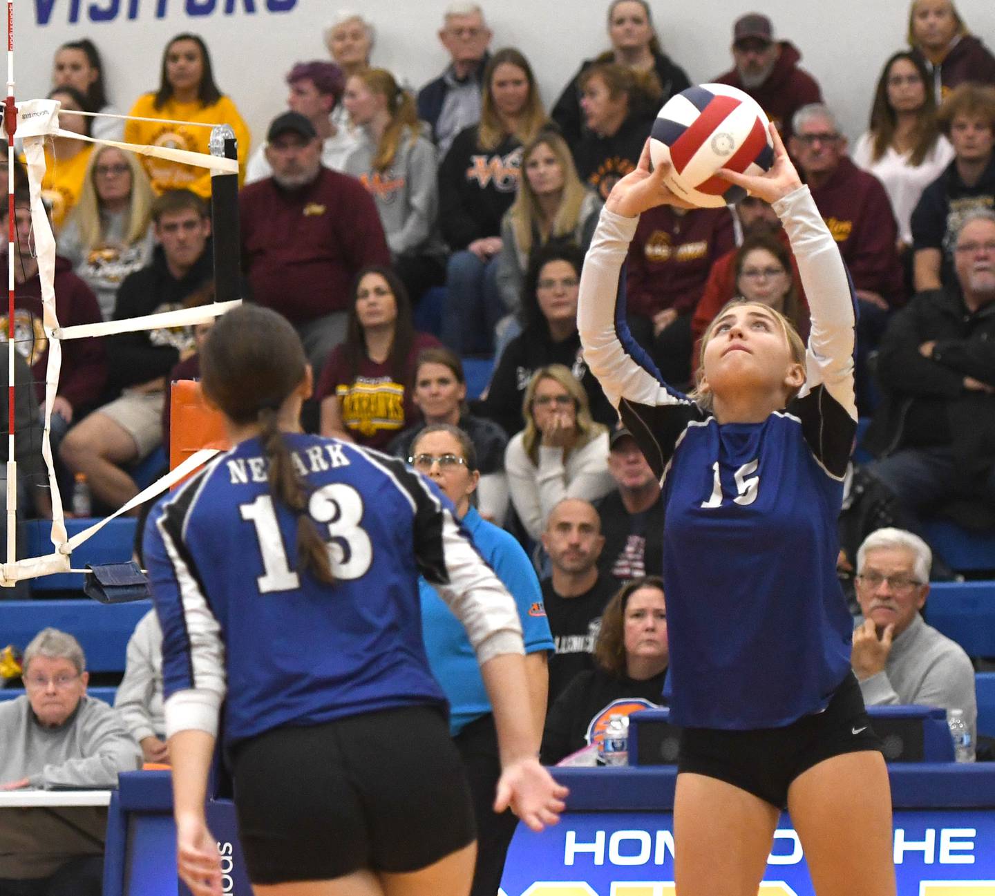 Newark's Taylor Jeffers (15) sets the ball as Tessa Kot (13) moves into hitting position during the second set at the 1A Eastland sectional on Tuesday, Nov. 4, 2025 in Lanark.