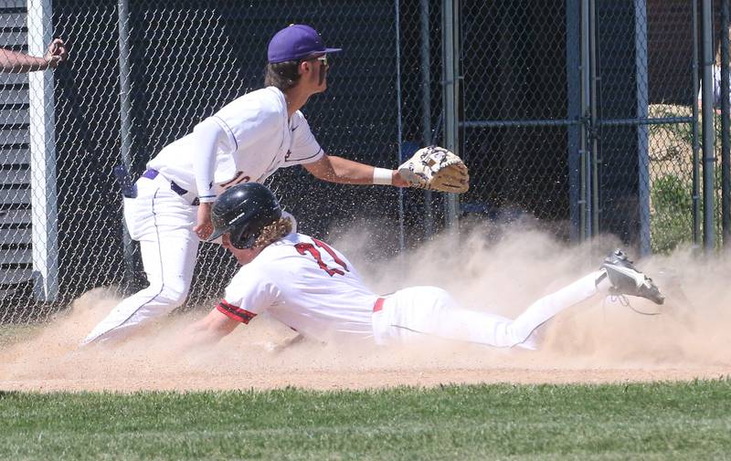 Hall's Mac Resetich slides underneath the throw of Sherrard third baseman Garrett Woodward during the Class 2A Sectional final game on Saturday, May 27, 2023 at Knoxville High School.