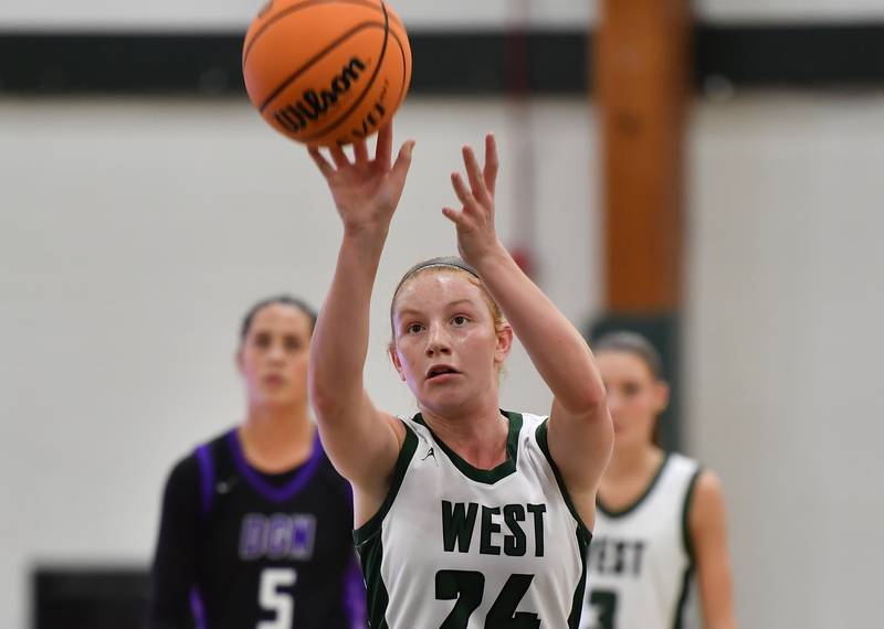 Glenbard West’s Sophia Evans scores with a free throw during a game against Downers Grove North on December 4, 2025 at Glenbard West High School in Glen Ellyn.