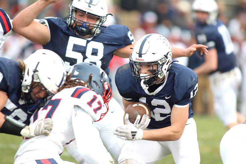 Cary-Grove’s Landon Barnett looks for running room against  Belvidere North in IHSA Class 6A quarterfinal playoff football action on Saturday, Nov. 16, 2024, at Al Bohrer Field on the campus of Cary-Grove High School in Cary.