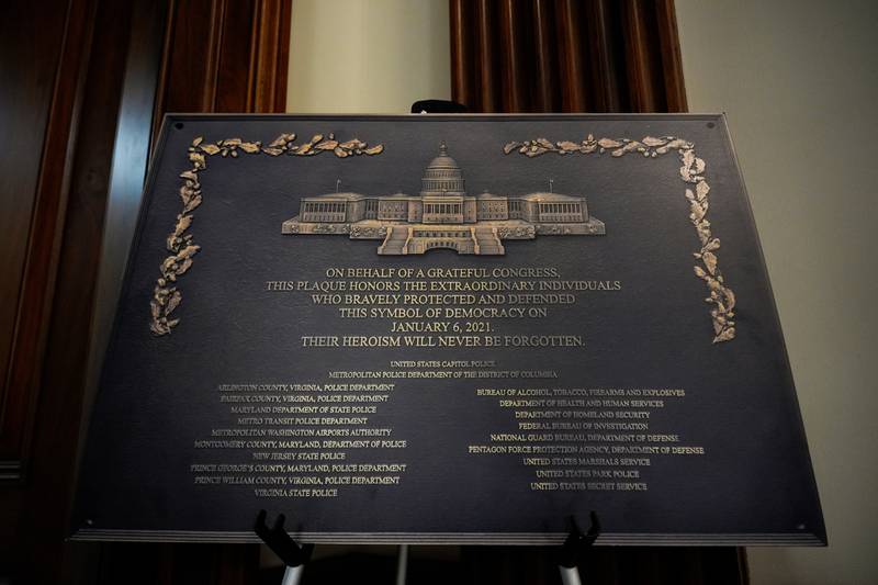 A replica plaque commemorating the Jan. 6, 2021 Capitol riot stands outside the office of House Minority Leader Hakeem Jeffries, D-N.Y, Tuesday, Dec. 30, 2025, at the U.S. Capitol in Washington. (AP Photo/Julia Demaree Nikhinson)