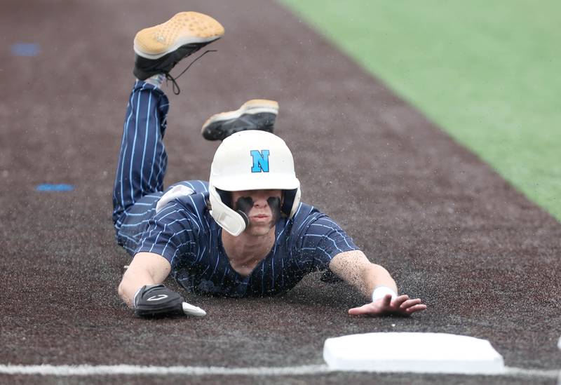 Nazareth's Nick Drtina slides into third Friday, June 10, 2022, during their IHSA Class 3A state semifinal game against Crystal Lake South at Duly Health and Care Field in Joliet.