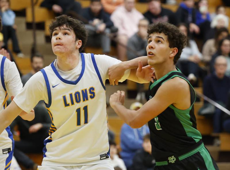 York's (3) Sawyer Asgedom fights for a rebound against Lyons' Tommy Blyth (11) during a varsity basketball game between York Community and Lyons Township high schools on Friday, Jan. 9, 2026 in La Grange.