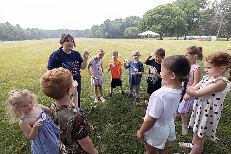 Diane Baker, Whiteside County Ag in the Classroom director, instructs campers on how to make butter Thursday, June 29, 2023 at Woodlawn Arts Academy.