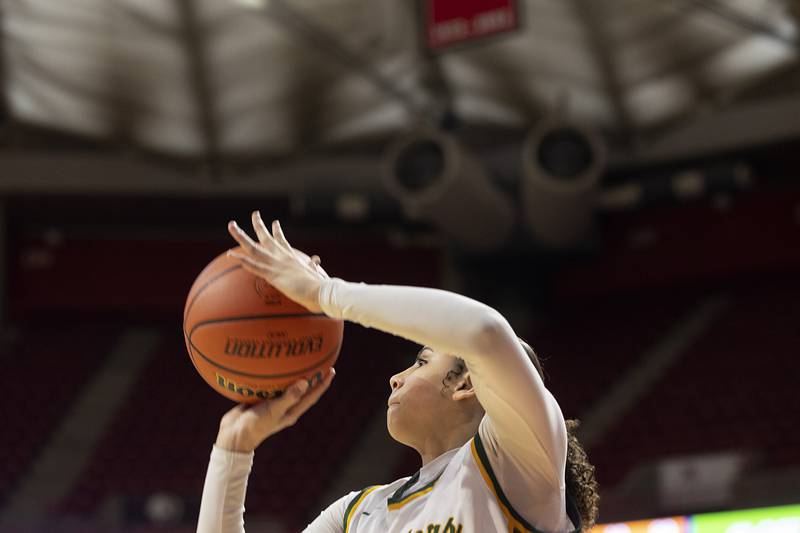 Waubonsie Valley’s Danyella Mporokoso puts up a shot against Nazareth Academy Friday, March 1, 2024 in the girls basketball 4A state semifinal at CEFCU Arena in Normal.