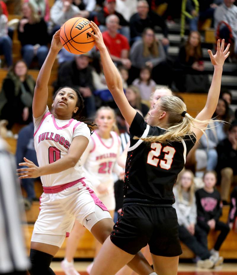 Batavia's Sapphira Thompson-Woods has her shot blocked by St. Charles East's Alyse Price during a game on Thursday, Feb. 6, 2025 in Batavia.