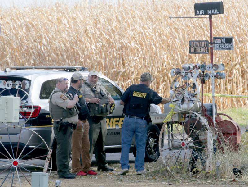 Bureau County Sheriff officers gather at the scene of an incident in the 200 block of E. Long Street on Monday, Oct. 24, 2022 in Ohio, Ill. A suspect is in custody and there is no longer a threat to the community, the Bureau County Sheriff’s Office told Ohio Community School District.