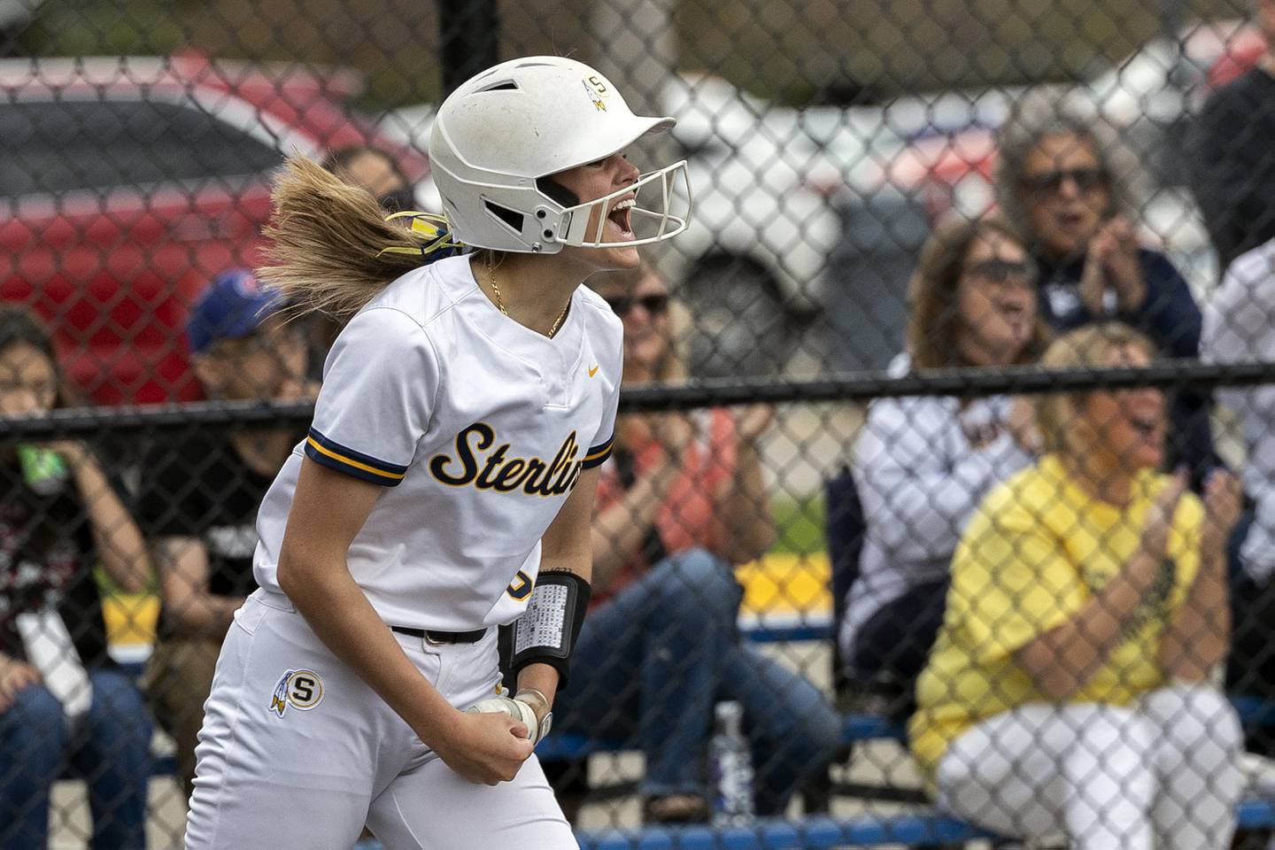 Sterling’s Marley Sechrest celebrates a two-run double by teammate Sterling’s Lily Martinez against Moline Tuesday, April 22, 2025.
